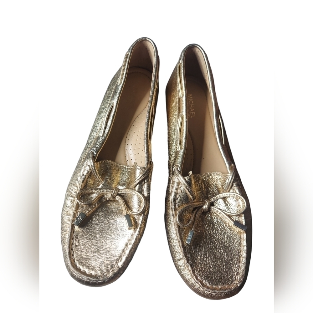 7‎ Michael Kors gold loafers